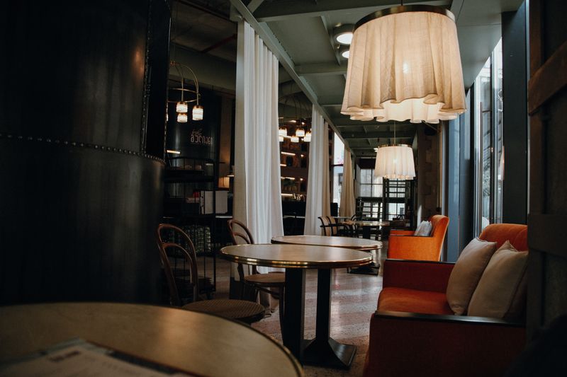 Jet's pizza cozy main dining area with warm lighting and comfortable seating